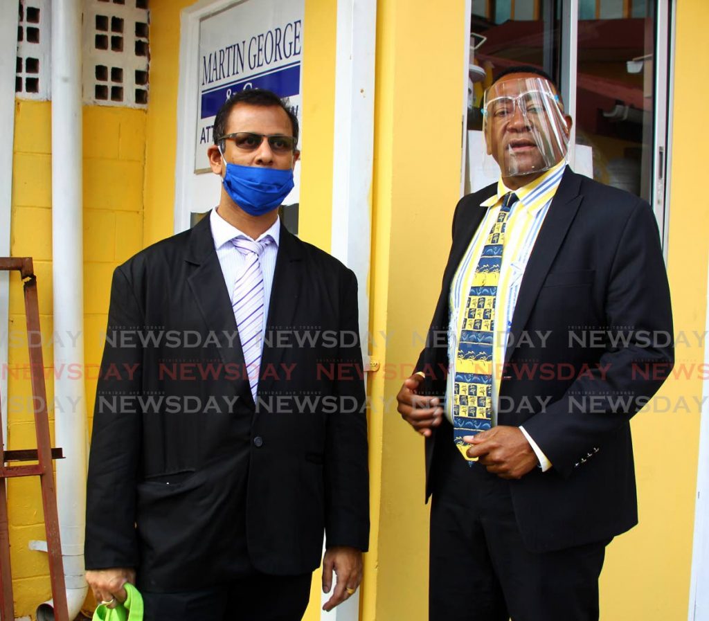 Dr Avinash Sawh with his attorney Martin George. - 