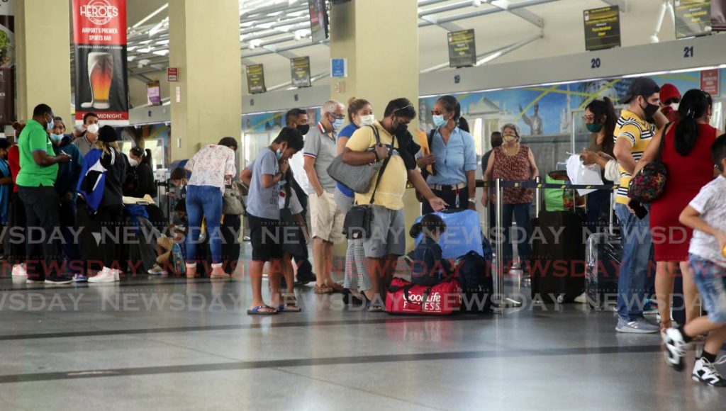 Venezuelans at the check-in counter at Piarco Airport for a repatriation flight back home. Photo by Sureash Cholai - Sureash Cholai