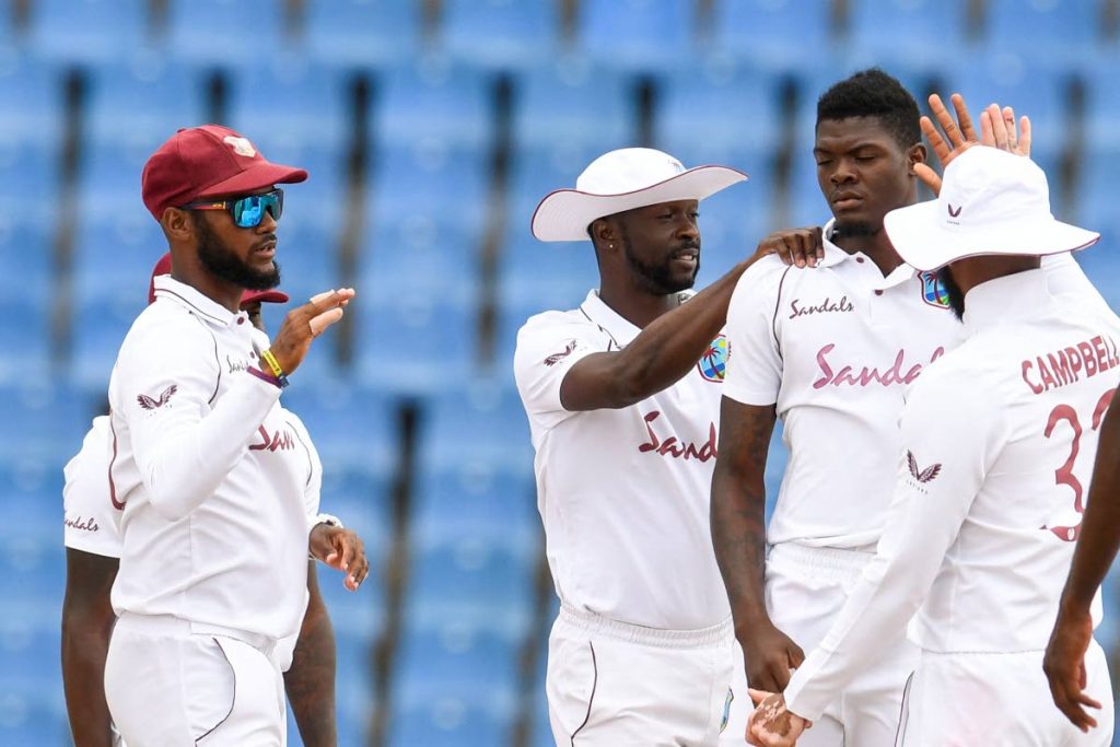 In this March 31 fiile photo, Kraigg Brathwaite (L), Kemar Roach (2L) and Alzarri Joseph (3L) of West Indies celebrate the dismissal of Suranga Lakmal of Sri Lanka of during day 3 of the 2nd Test at the Sir Vivian Richards Cricket Stadium in North Sound, Antigua. - (AFP PHOTO)