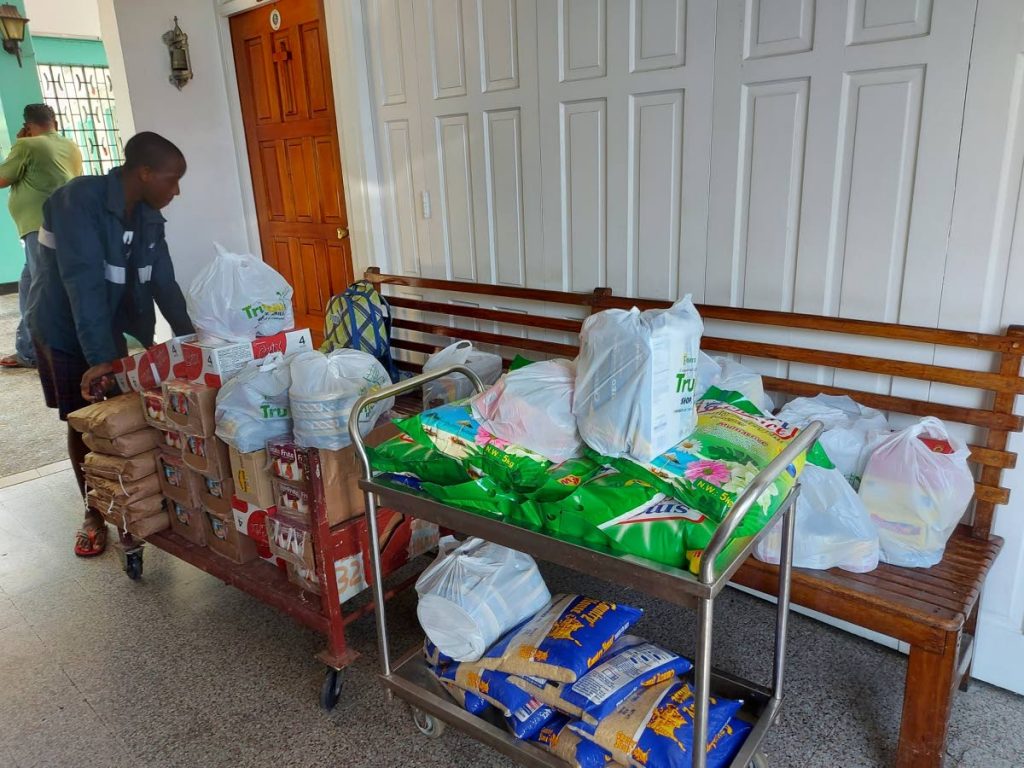 CHINESE DONATION: An employee at the Lady Hochoy Home moves a trolly of food items which were donated by Chinese ambassador Fang Qiu.  - 