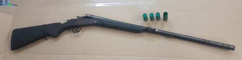 The 12-gauge shotgun and ammunition police recovered on Friday. - Courtesy TTPS