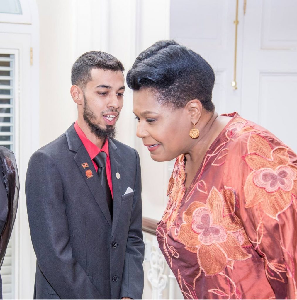 FLASHBACK: President Paula-Mae Weekes listens attentively to President's medal silver recipient, Abdullah Hassim at the award ceremony at President's House on January 18, 2020. Hassim died on June 5 and tested positive for covid19. - Office of the President
