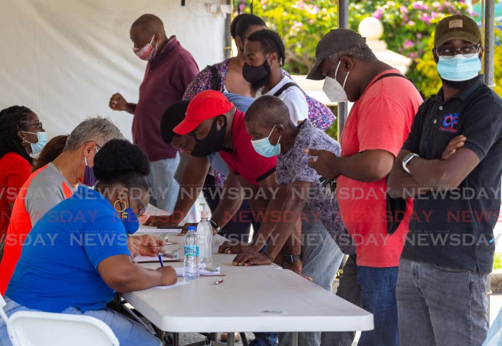 Flashback: Construction workers, right, are pre-screened at the Magdalena Grand Beach and Golf Resort car park ahead of receiving their covid19 vaccines last week. - DAVID REID