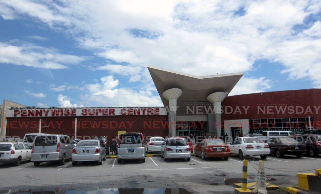 In this file photo, cars line the eastern side of Trincity Mall outside the Pennywise Super Centre - 