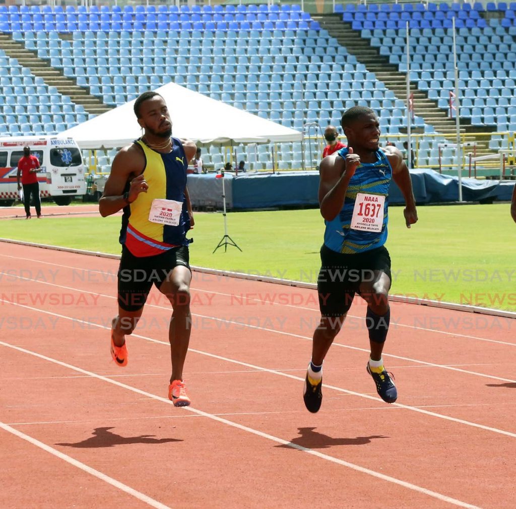 Abilene Wildcats’ Ayodele Taffe (R) wins the men’s 100m dash ahead of second-placed Jonathan Farinha (L), on Day II of the NAAA Olympic qualifiers, at the Hasely Crawford Stadium, Port of Spain, on Sunday. - SUREASH CHOLAI