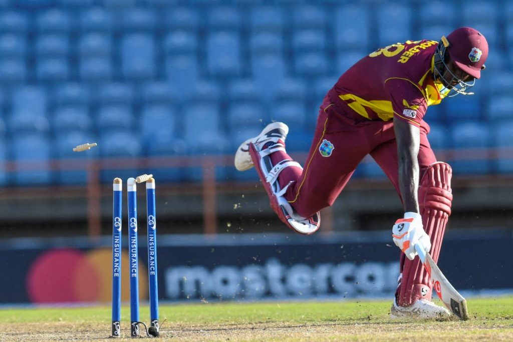 Jason Holder of West Indies is run out by Anrich Nortje of South Africa during the 2nd T20I between West Indies and South Africa at Grenada National Cricket Stadium, Saint George's, Grenada, on Sunday.  (AFP PHOTO)