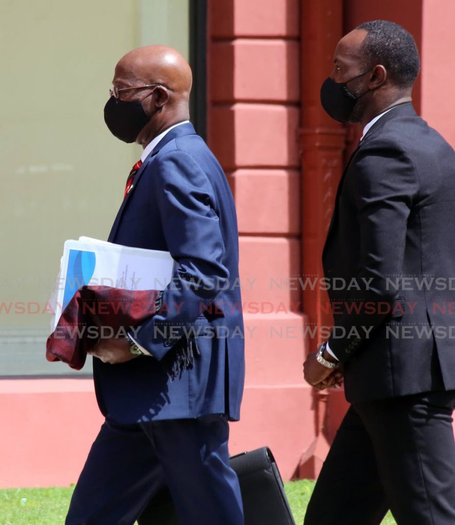 Prime Minister Dr Keith Rowley, left, arrives at the Red House on Tuesday. - SUREASH CHOLAI