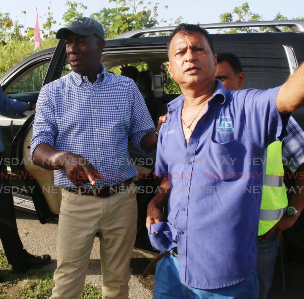 In this 2017 file photo, A&V Oil owner Nazim Baksh, right,  with Prime Minister Dr Keith Rowley during a tour of flood affected areas in Penal.  - 