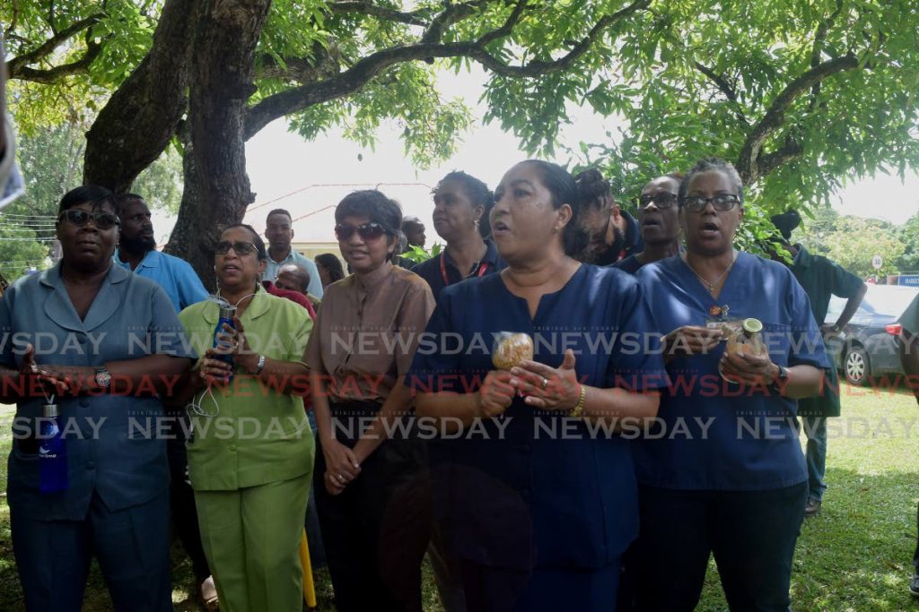 FILE PHOTO: UWI workers chant, 