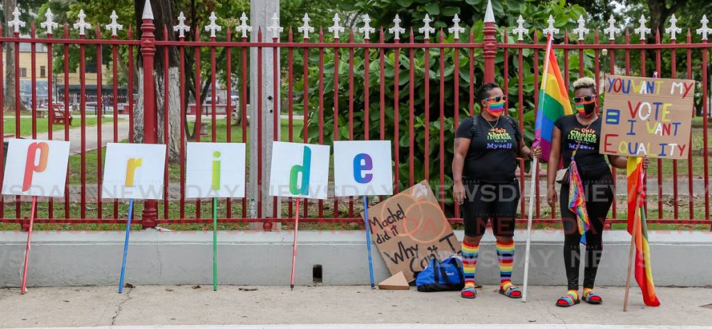 File photo: Eva and Nicole Chavez of PrideTT launch Pride month opposite the Red House, Abercromby Street, Port of Spain  - Photo by Jeff Mayers