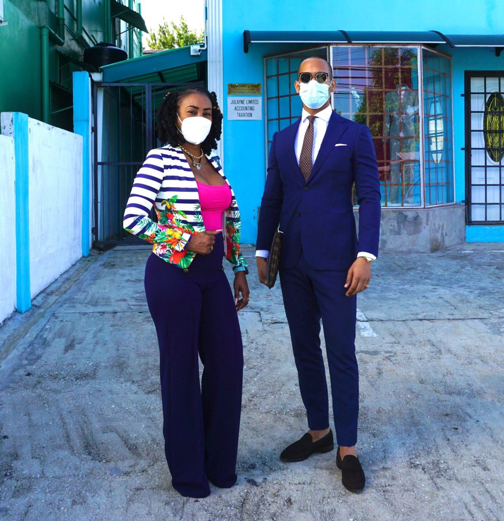 Attorney Lasana Murray and his client Cindy Brooks, outside his Guanapo Street, Arima office shortly after the magistrate's order. 