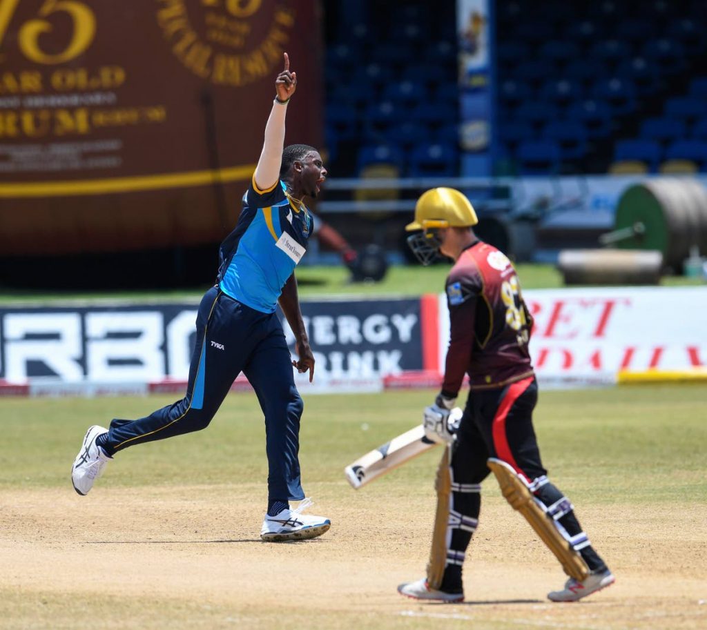 In this August 29, 2020 file photo, Jason Holder (left) of Barbados Tridents celebrates the dismissal of Colin Munro (right) of Trinbago Knight Riders during the Hero Caribbean Premier League match 17 between Barbados Tridents and Trinbago Knight Riders at Queen's Park Oval, St Clair. (PHOTO COURTESY CPL T20) - 