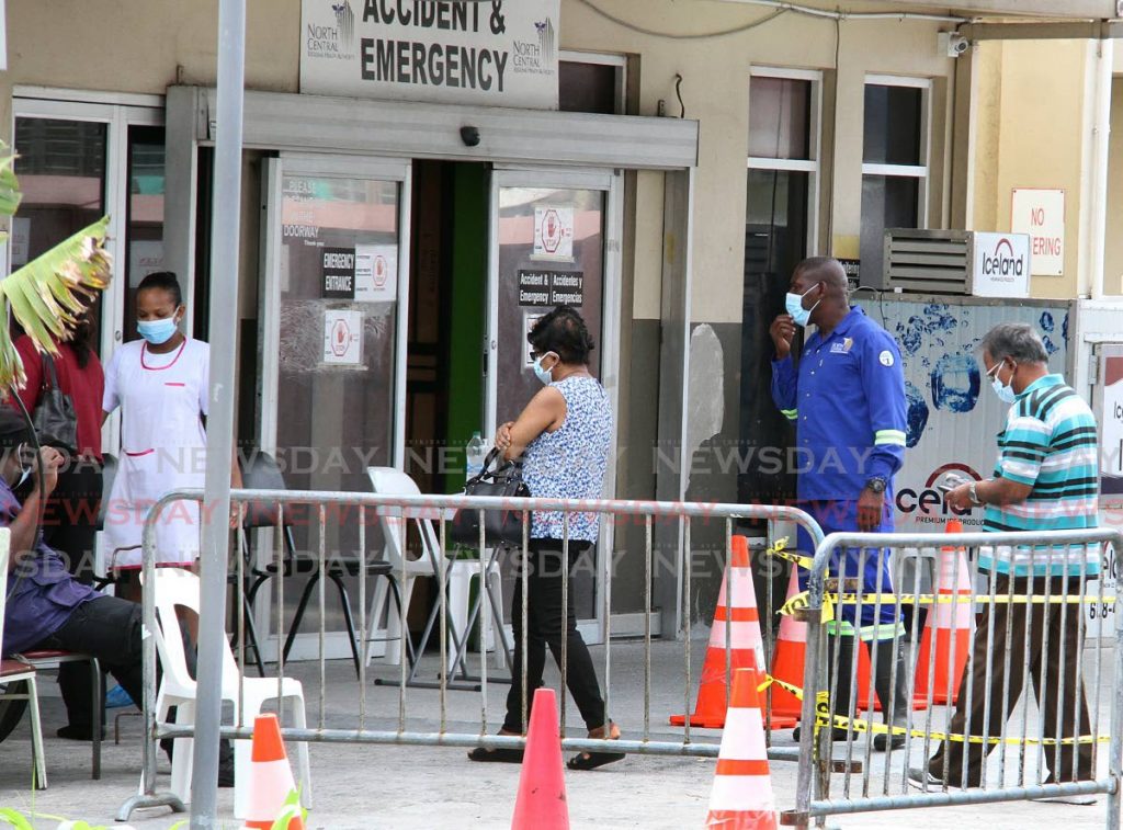 People entering the Chaguanas District Health Facility. Photo by Angelo Marcelle - 