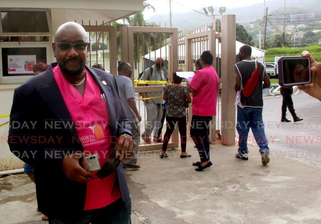 North Central Regional Health Authority CEO Davlin Thomas with his mask off for an interview outside of the St Joseph Enhanced Health Centre where people arrived for vaccinations on June 16.  - PHOTO BY SUREASH CHOLAI