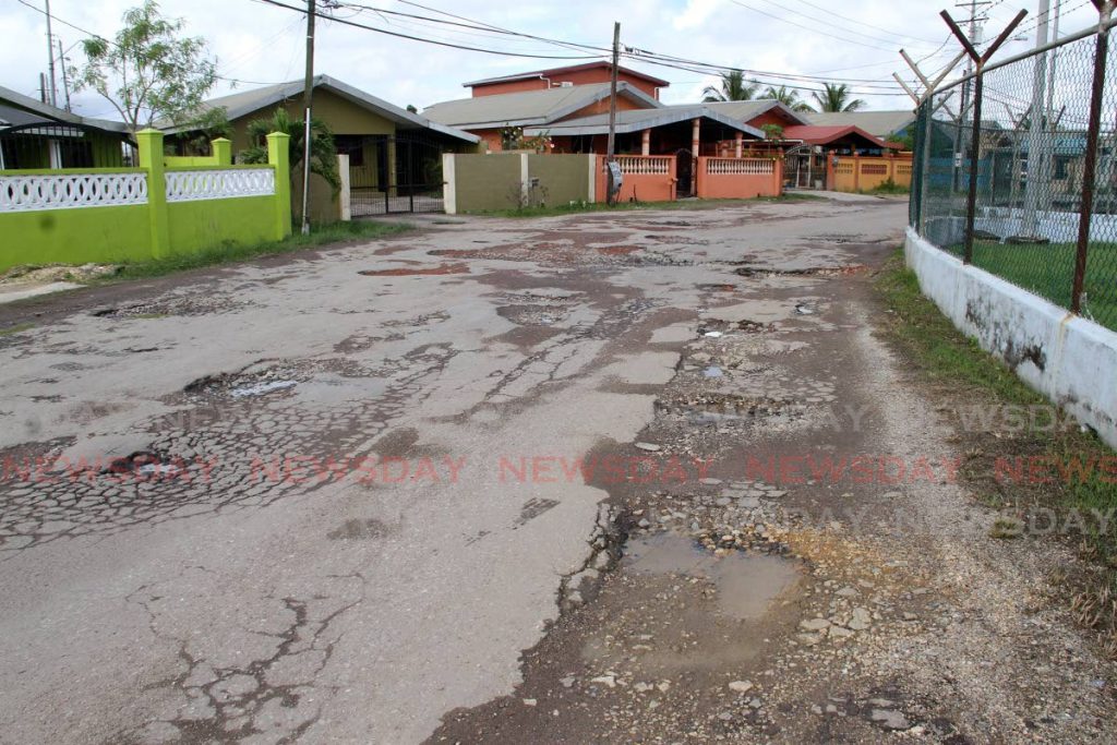 LOOK AT THIS ROAD: Tasker Avenue in Cashew Gardens, Edinburgh - one of the many roads in that area which is in a deplorable state. PHOTO BY ANGELO MARCELLE  - 