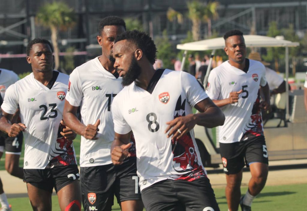 TT midfielder Khaleem Hyland, second from right, trains alongside his teammates ahead of the CONCACAF Gold Cup qualifiers.  - TTFA Media