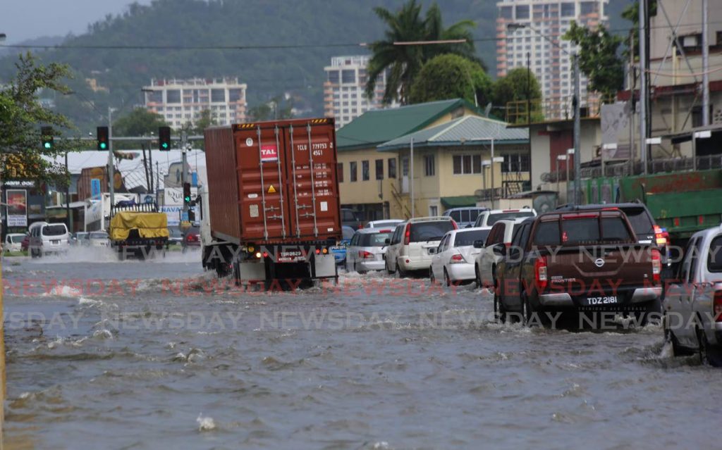 Flash flooding on Wrightson Road, Port of Spain on July 6 disrupted the flow of traffic after heavy rainfall. - PHOTO BY SUREASH CHOLAI
