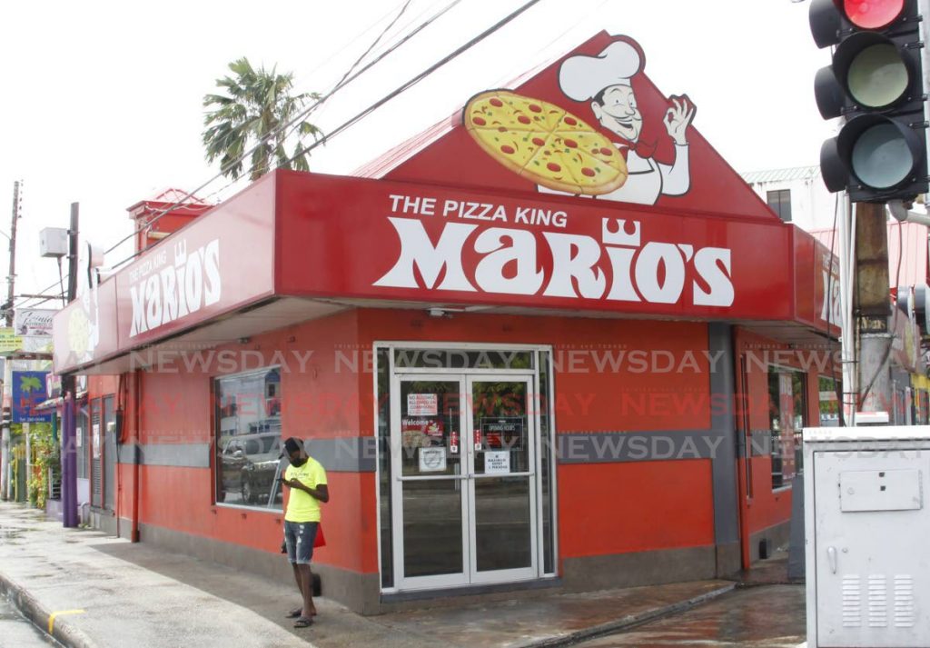 Mario's Pizzeria outlet on Cipriani Boulevard, Port of Spain. In a memo to staff, CEO Roger Harford said only vaccinated employees will be allowed to work when restaurants reopen on July 19.  Photo by Roger Jacob