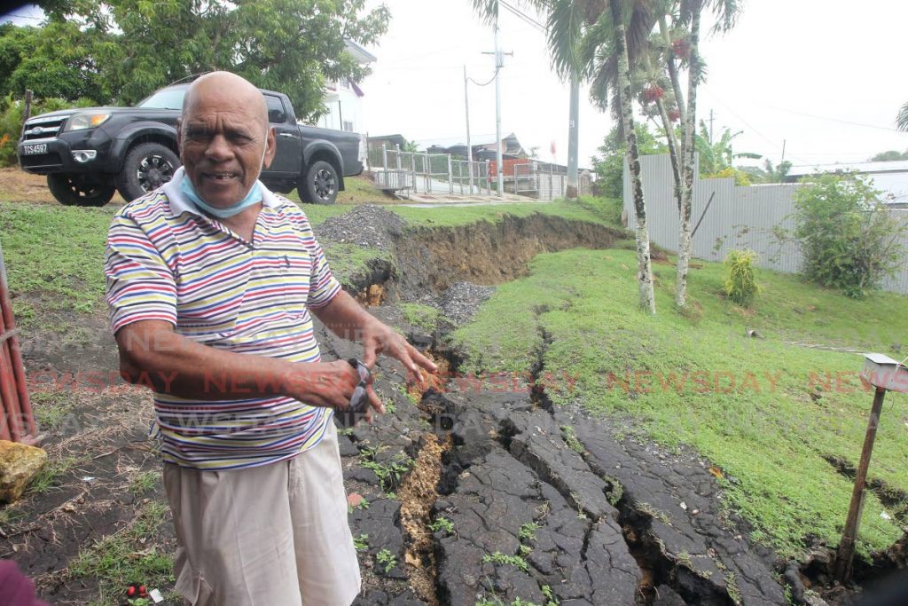 Lalchan Ramsawak, 78, is calling for assistance as the land on his property at Cipero road, Borde Narve village, Princes Town started moving damaging his home and threatening the home of his neighbour. - Photo by Lincoln Holder