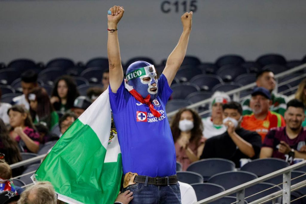 A Mexico fan cheers prior to a Concacaf Gold Cup Group A  match against Trinidad and Tobago in Arlington, Texas, on Saturday (AP Photo) - 