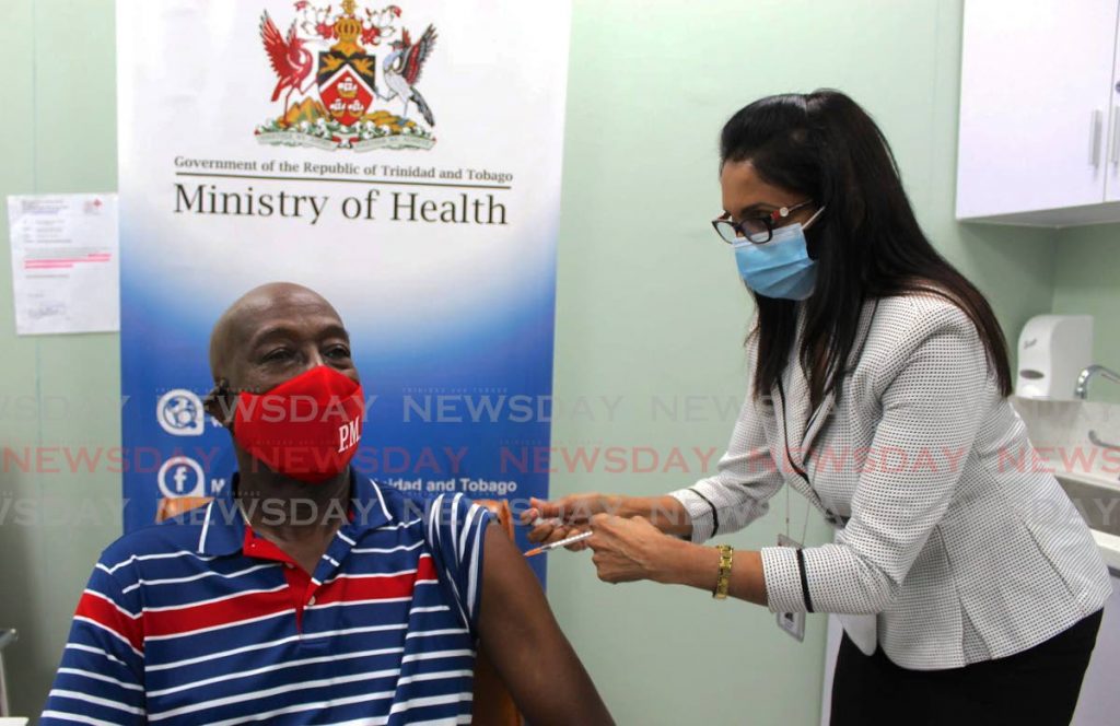 JABBED: Prime Minister Dr Keith Rowley receives his first dose of the Sinopharm covid19 vaccine on Tuesday at the Diego Martin Health Centre. PHOTO COURTESY OFFICE OF THE PRIME MINISTER - OPM