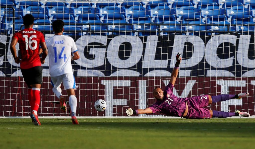 Trinidad goalkeeper Nicklas Frenderup (right) is unable to stop a shot on goal from El Salvador midfielder Jairo Henriquez, not pictured, during a 2021 CONCACAF Gold Cup Group A match, on Wednesday,in Frisco, Texas. (AP PHOTO) - 