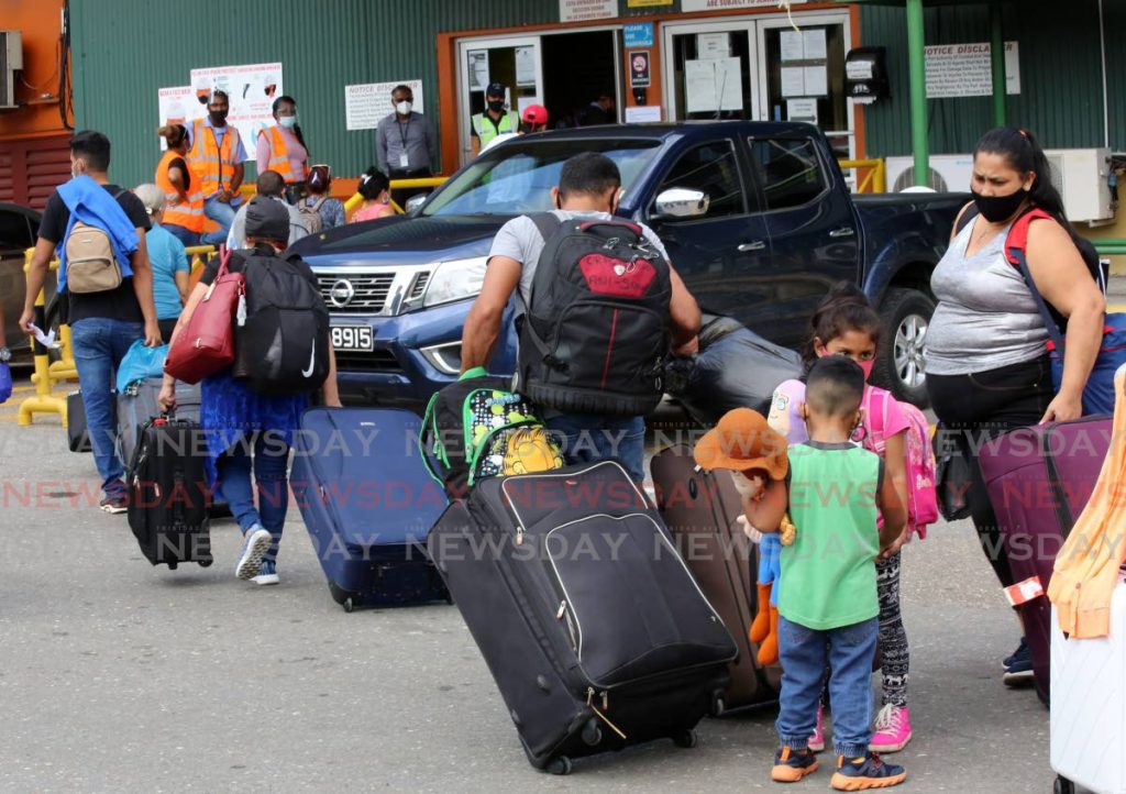 A group of Venezuelan nationals as they arrived at the Cruise Ship Complex in Port of Spain to return home on Saturday. - Photo by Sureash Cholai