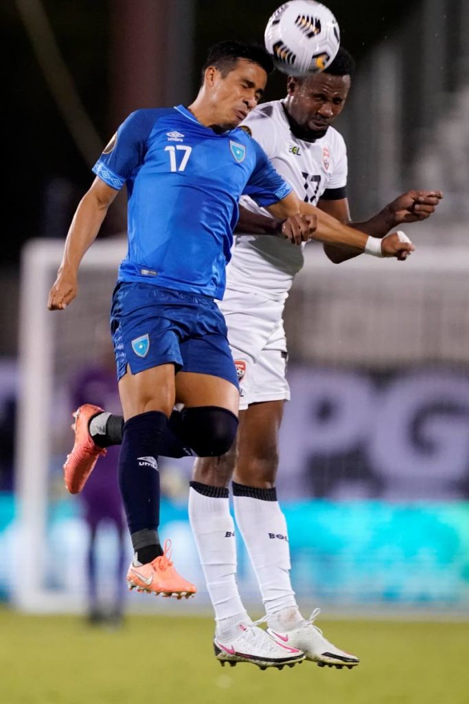Guatemala forward Luis Martinez, left, and Trinidad and Tobago defender Justin Garcia, right, compete for the ball in the second half of a Concacaf Gold Cup Group A, round 3 match, on July 18, 2021, in Frisco, Texas.  - 
