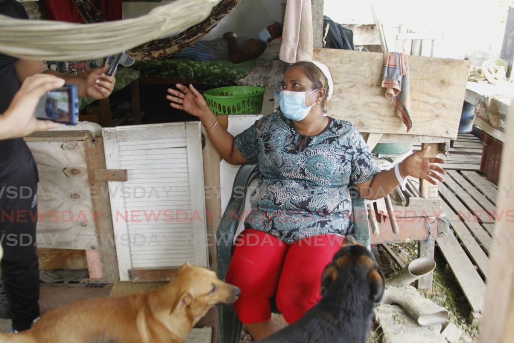  Rita Lutchman speaks to Newsday about the tramatic encounter with bandits on Wednesday night, behind her husband lay in a makeshift bed recovering from a gun shot wound. Photo by Roger Jacob