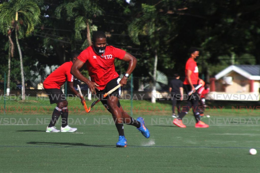 Trinidad and Tobago men's Under-21 hockey players take part in a practice session on the newly-opened astroturf field, at the Police Barracks, St James, on Thursday.  - Marvin Hamilton