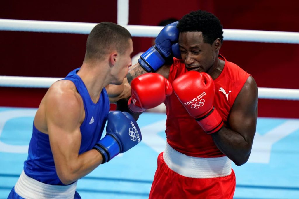 Andrej Csemez, of Solvakia, left, attacks Aaron Solomon Prince of Trinidad and Tobago, during their middle weight (75kg) preliminary boxing match at the 2020 Summer Olympics, Monday,  in Tokyo, Japan. (AP Photo) - 