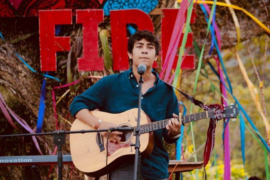 FILE: Viren Neel performs his cover of The Times They Are a-Changin’ at the New Fire Festival at the Ortinola estate in St Joseph in 2018. 
Photo courtesy Vishala Jabar. - 