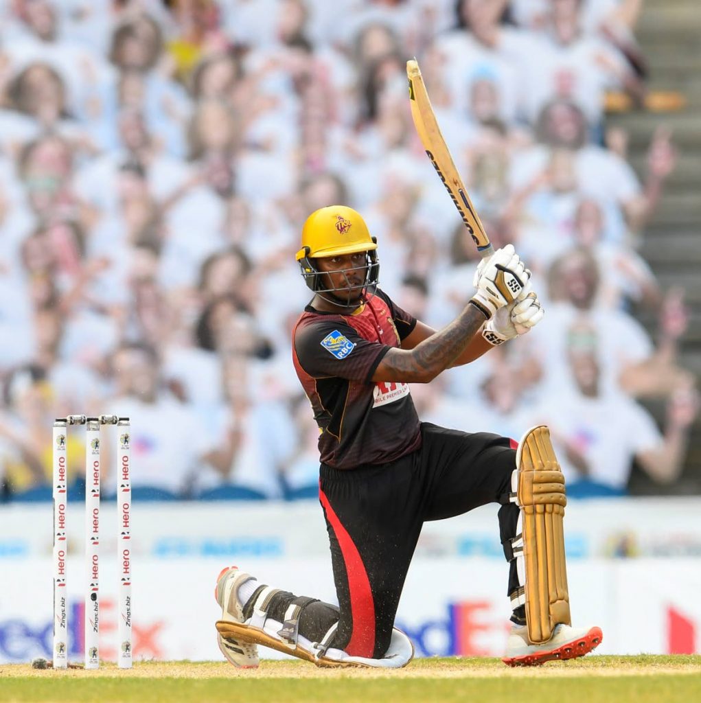 In this September 8, 2020 file photo, Tion Webster of Trinbago Knight Riders hits a four to win the Hero Caribbean Premier League play-off match 31 between Jamaica Tallawahs and Trinbago Knight Riders at Brian Lara Cricket Academy, Tarouba. - CPL T20 via Getty Images