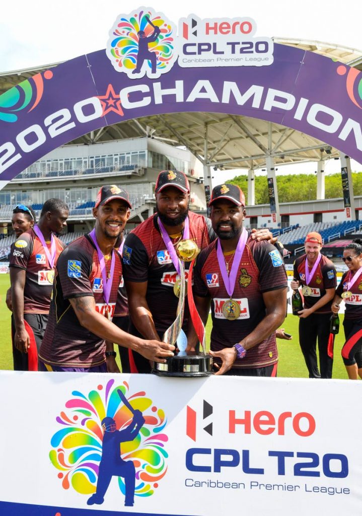 In this Sep 10, 2020 file photo, Lendl Simmons (L), Kieron Pollard (C) and Darren Bravo (R) of Trinbago Knight Riders display the championship trophy at the end of the Hero Caribbean Premier League final against St Lucia Zouks at Brian Lara Cricket Academy, Tarouba. - Photo courtesy CPL T20 