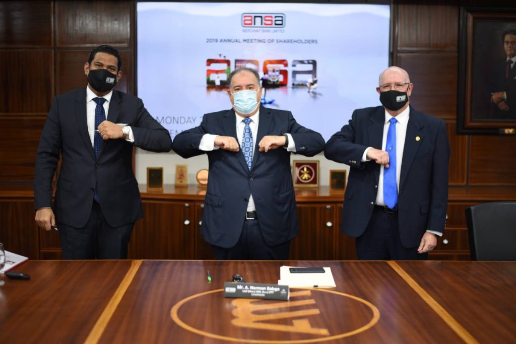 Ansa Merchant Bank chairman A Norman Sabga (centre) knocks elbows with managing director Gregory Hill (left) and corporate secretary Robert Ferreira at the 2019 annual meeting of shareholders held virtually on September 28, 2020. File photo - 