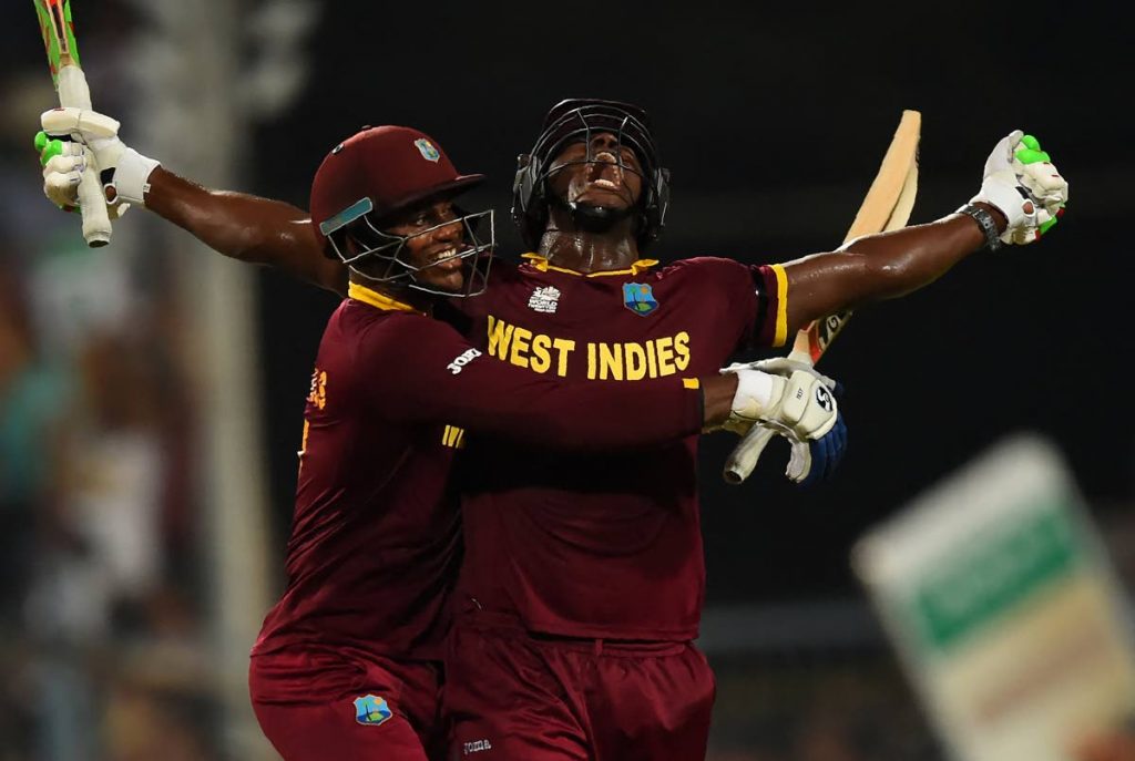 In this April 3, 2016 file photo, West Indies's Carlos Brathwaite(R)and teammate Marlon Samuels celebrate after victory in the World T20 final against England, at The Eden Gardens Cricket Stadium in Kolkata, India.  - 
