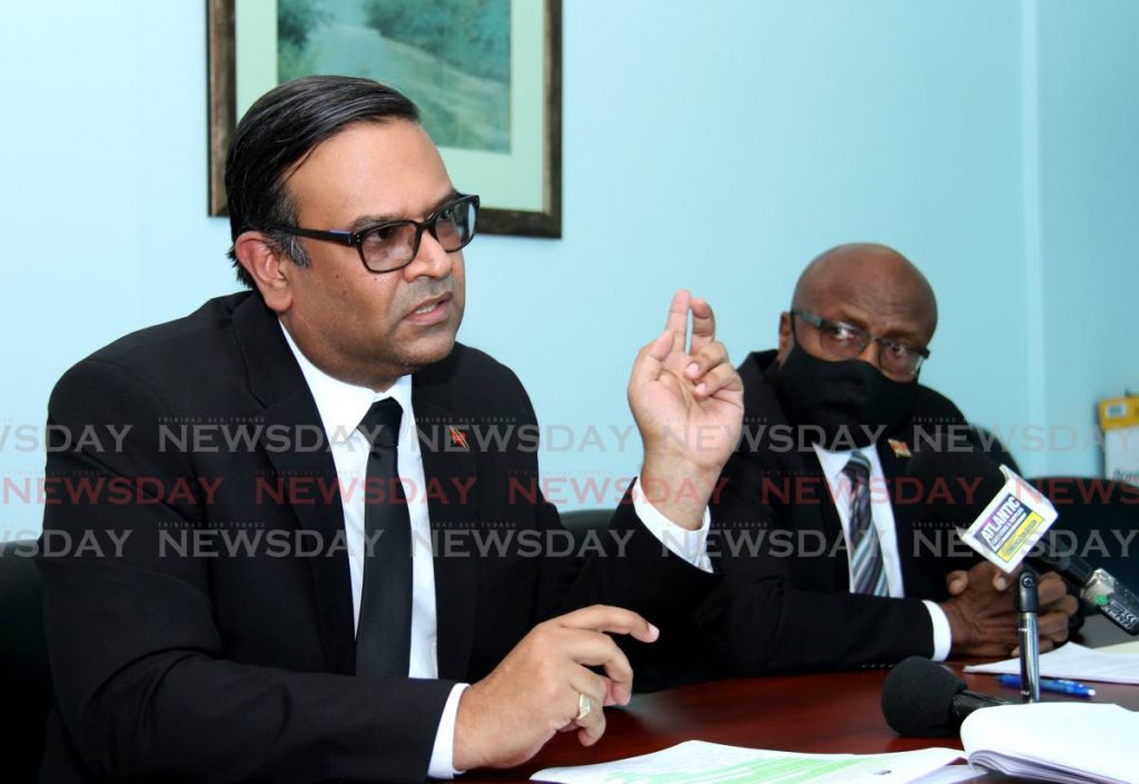 Caroni East MP Dr Rishad Seecheran, left, with Naparima MP Rodney Charles. - 