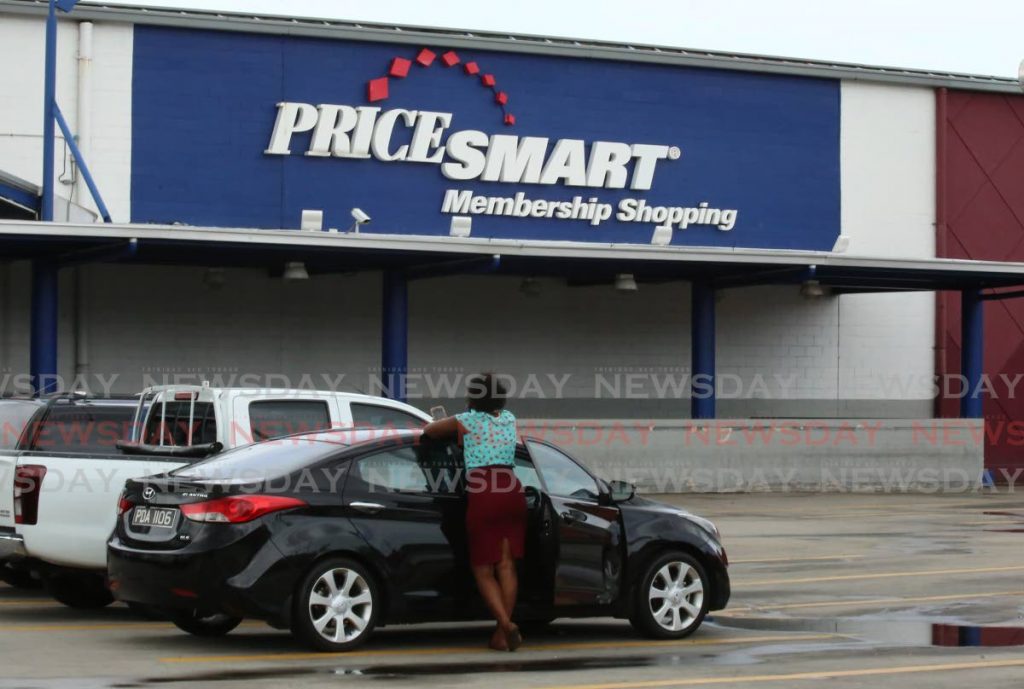 A customer waits for PriceSmart to open at MovieTowne plaza, Port of Spain on May 7, 2021. Photo by Sureash Cholai