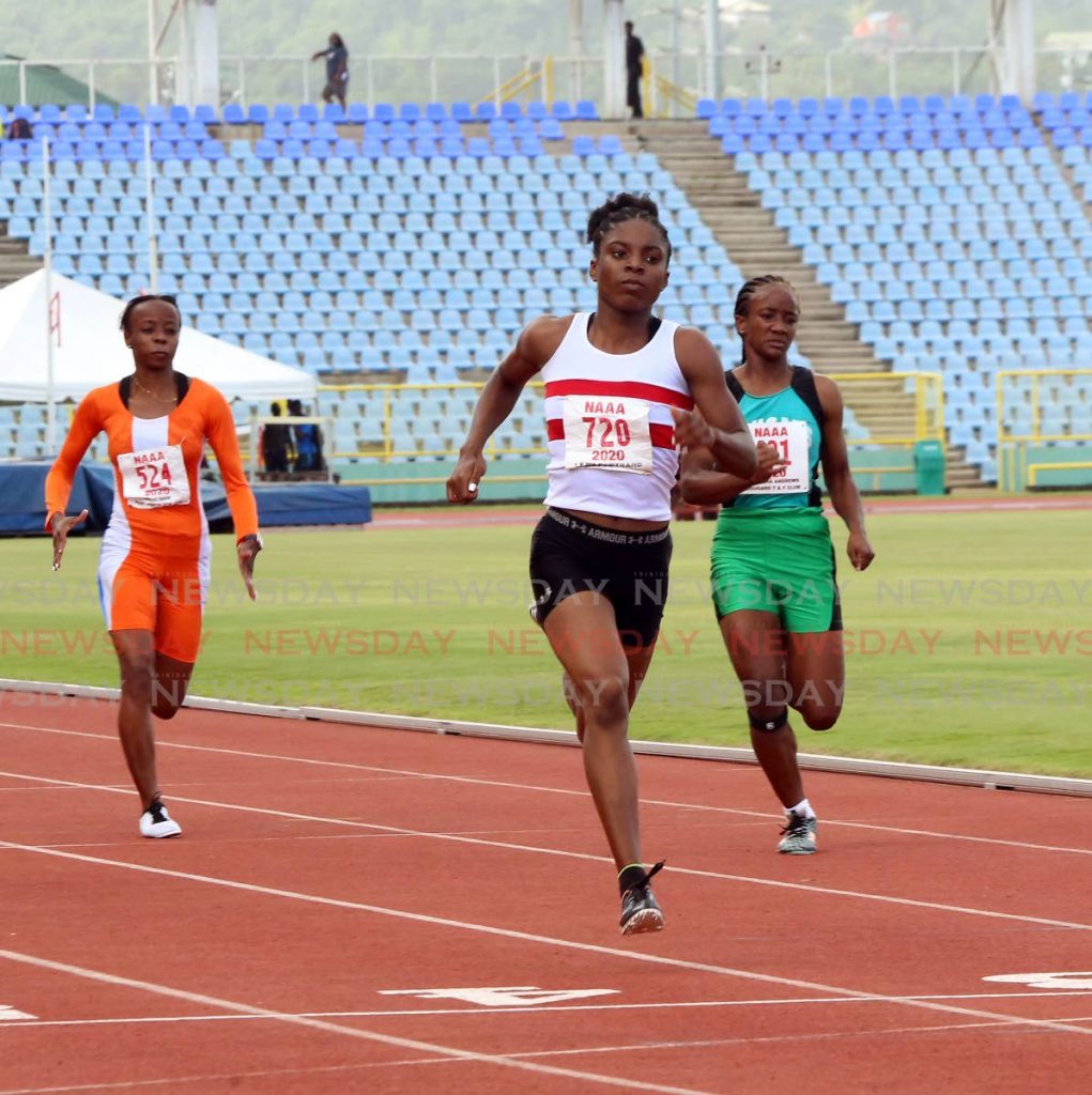 In this June 21 file photo, Leah Bertrand(C), of Simplex, wins the women’s 100m, during Day 1 of the NAAA Olympic qualifiers, at the Hasely Crawford Stadium, Mucurapo.   - SUREASH CHOLAI