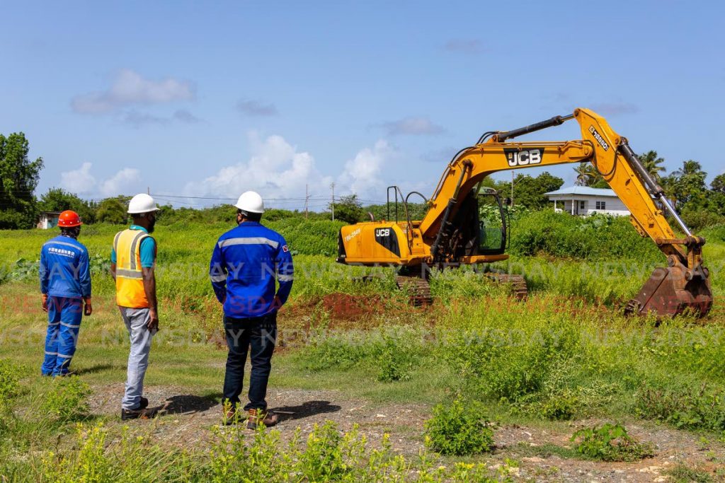 In this August 2021 file photo, an excavator is at work on the ANR Robinson airport expansion project at Store Bay Local Road, Crown Point, Tobago. File photo/David Reid