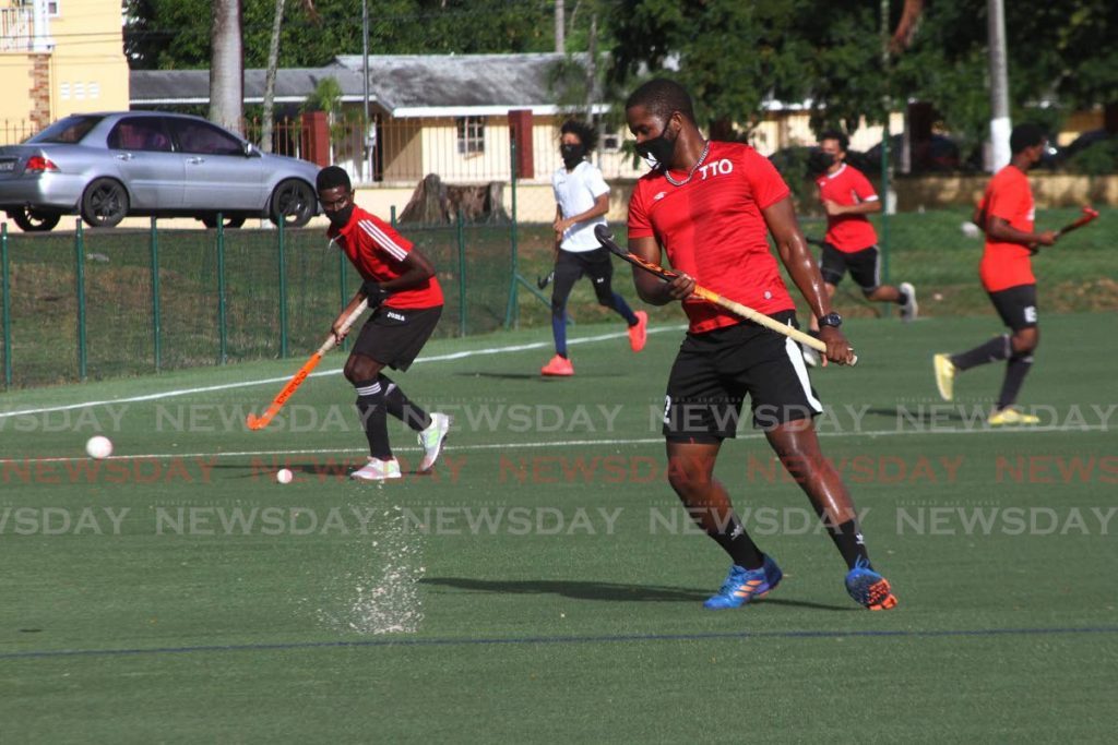 Trinidad and Tobago junior men's hockey team during a training session, at the opening of the Police Barracks' astroturf field, in St James. - Marvin Hamilton