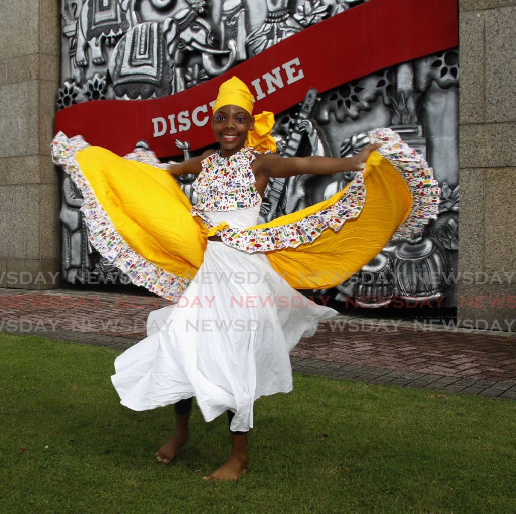 Dillyann Irving performs the bele outside the International Finance Centre, Port of Spain.  - PHOTO BY ROGER JACOB