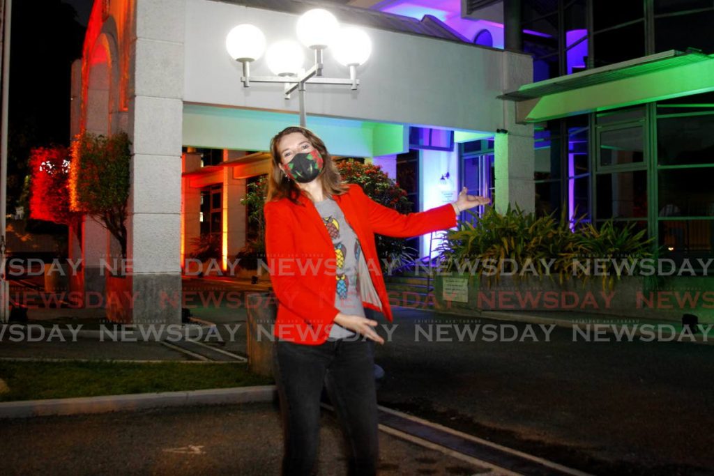 British High Commissioner Harriet Cross celebrates the lighting up of the high commission building in St Clair in rainbow colours in support of the LGBTQ+ community at the end of Pride Month on Friday. - PHOTO BY ROGER JACOB