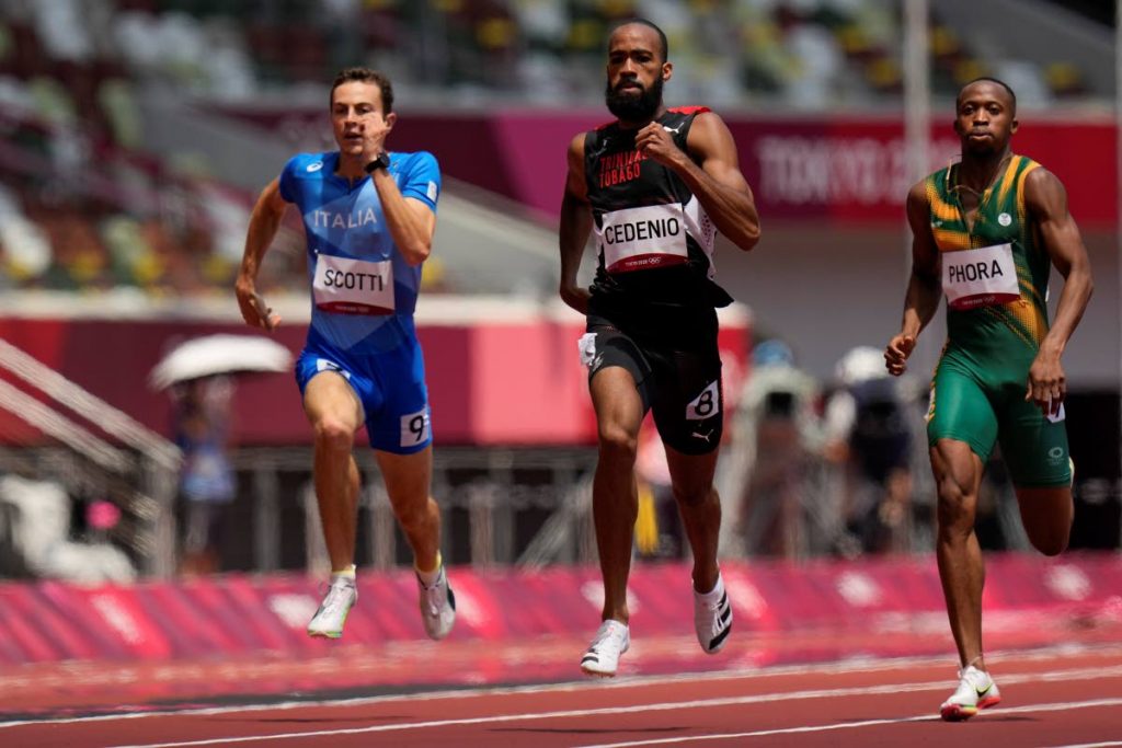 Machel Cedenio, of Trinidad and Tobago, runs in a heat in the men's 400m at the 2020 Summer Olympics, Sunday, in Tokyo. (AP Photo) - 