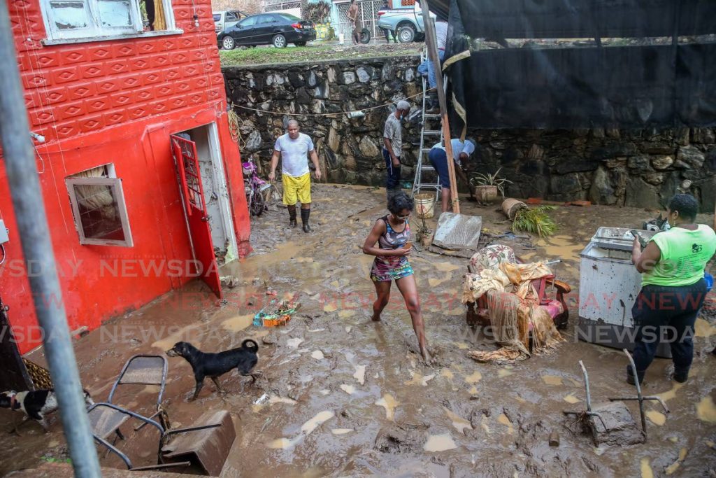 Mud literally got into everything: the house, the clothes, the furniture, the toys, even the dogs at this home on Symond Valley Road, St Ann's after it was bludgeoned by massive flooding on Tuesday. - Photo by Jeff Mayers