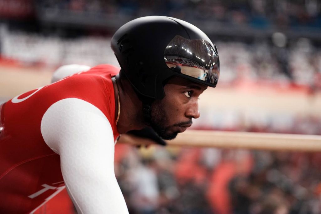 Kwesi Browne of Team Trinidad And Tobago gets set to compete during the track cycling keirin race at the 2020 Summer Olympics, on Saturday, in Izu, Japan. AP Photo - 