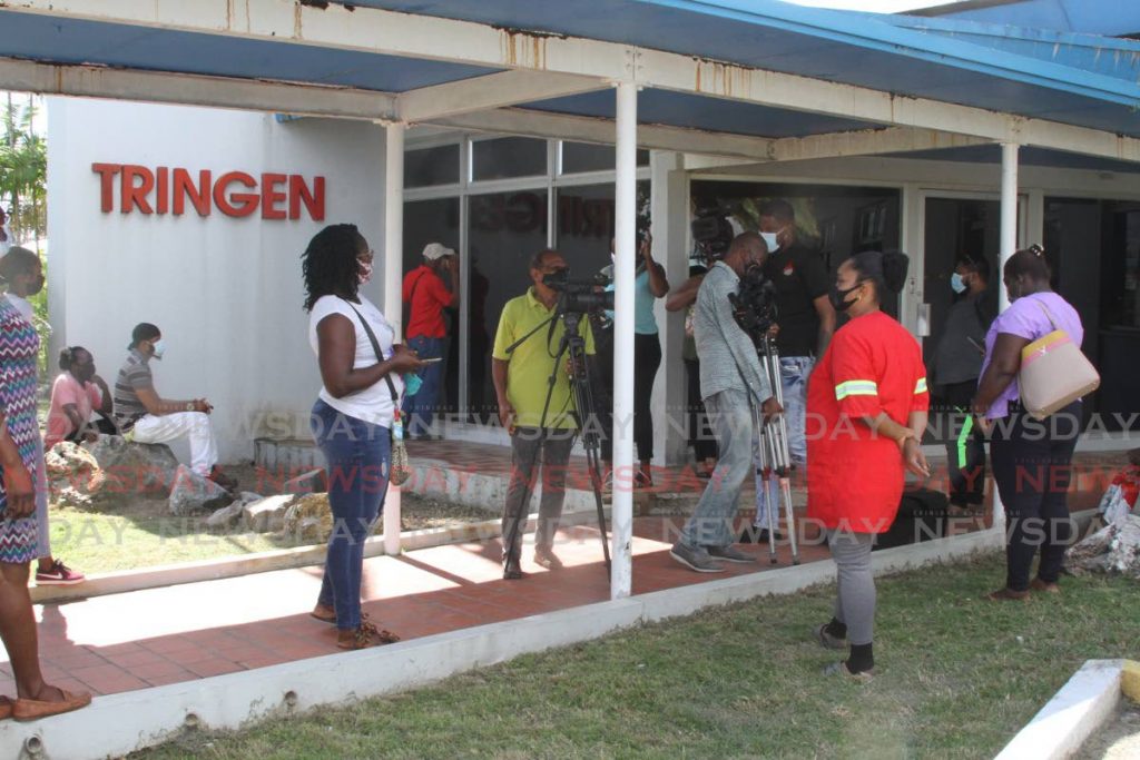 Media workers were asked to leave the Tringen compound, Savonetta, as a meeting took place between eTecK officials and residents affected by construction fo the Phoenix Park industrial estate on Tuesday. - Marvin Hamilton