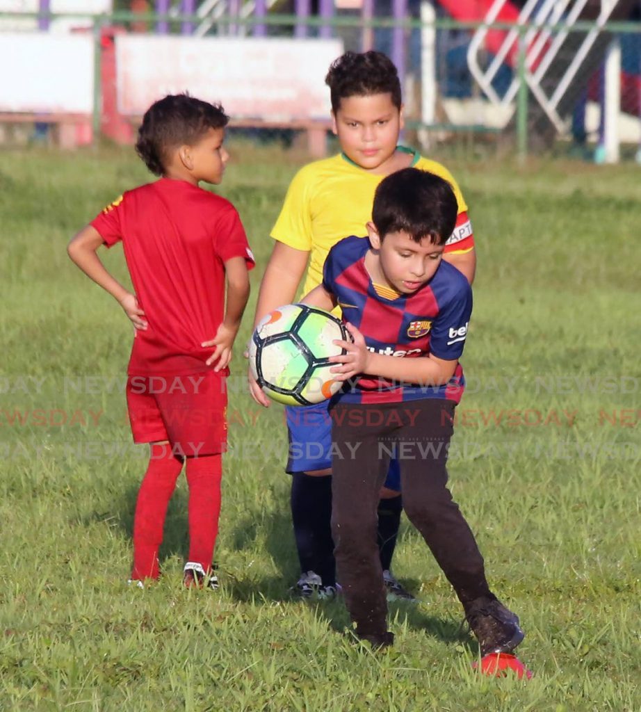 Venezuelan children Guerreros FC Soccer School at play game at the Nelson Mandela Park, Port of Spain. Photo by Sureash Cholai