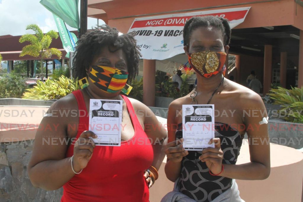 Joanne O'Garro got her second dose of a covid19 vaccine, and daughter Djennicia Francis got her first dose, at the Divali Nagar in Chagaunas on Saturday. - Photo by Marvin Hamilton