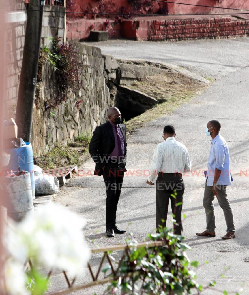 ON THE SCENE: DPP Roger Gaspard (left) speaks with Supt Wayne Abbott (centre) and another investigator at Second Caledonia, Morvant where three men were shot dead by police on June 27, 2020. Photo by Angelo Marcelle